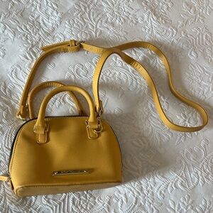 Betsy Johnson yellow purse with adjustable strap and bow